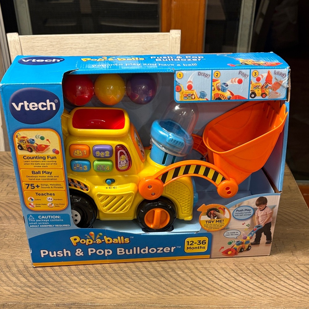 VTech Pop-a-Balls Push & Pop Bulldozer - Yellow and Orange - Picture 1 of 4